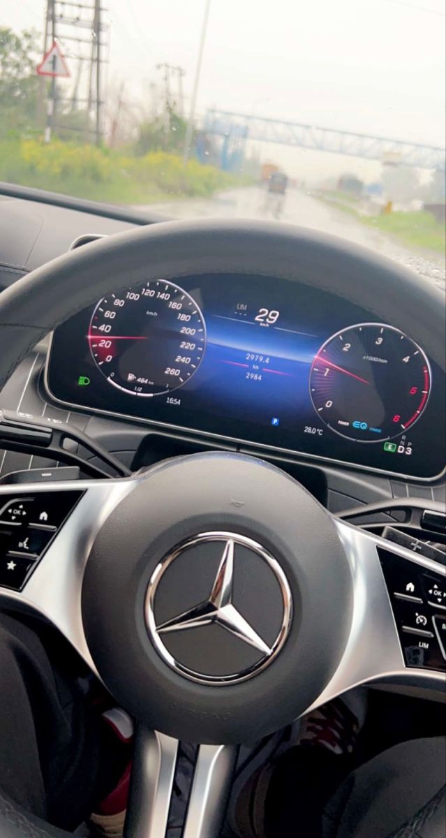 the steering wheel and dashboard of a mercedes benz - benz car with digital gauges