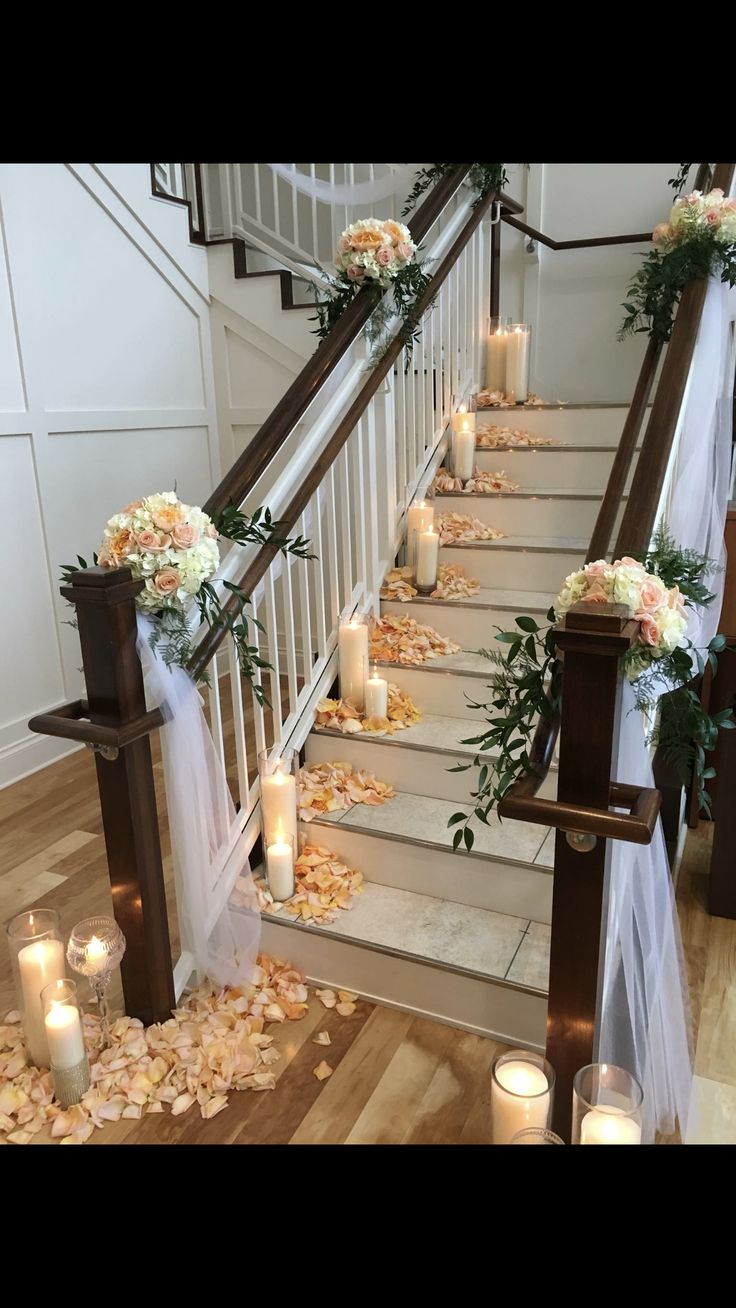 the stairs are decorated with flowers and candles