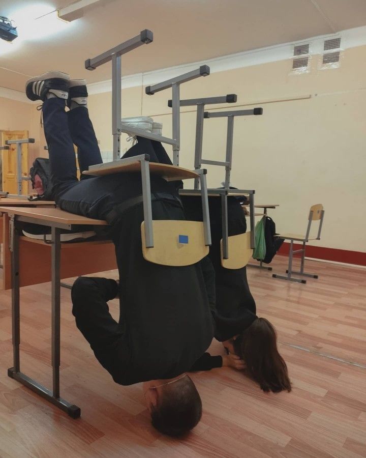 a man sitting at a desk with his back to the camera