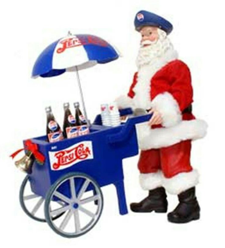 a man dressed as santa clause standing next to a blue and white ice cream cart