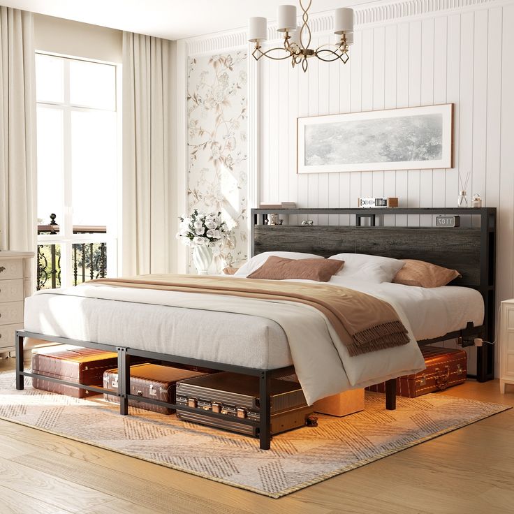 a large bed sitting on top of a hard wood floor next to a white dresser