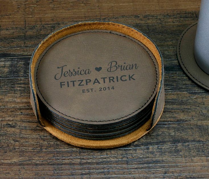 personalized coasters are stacked on top of each other