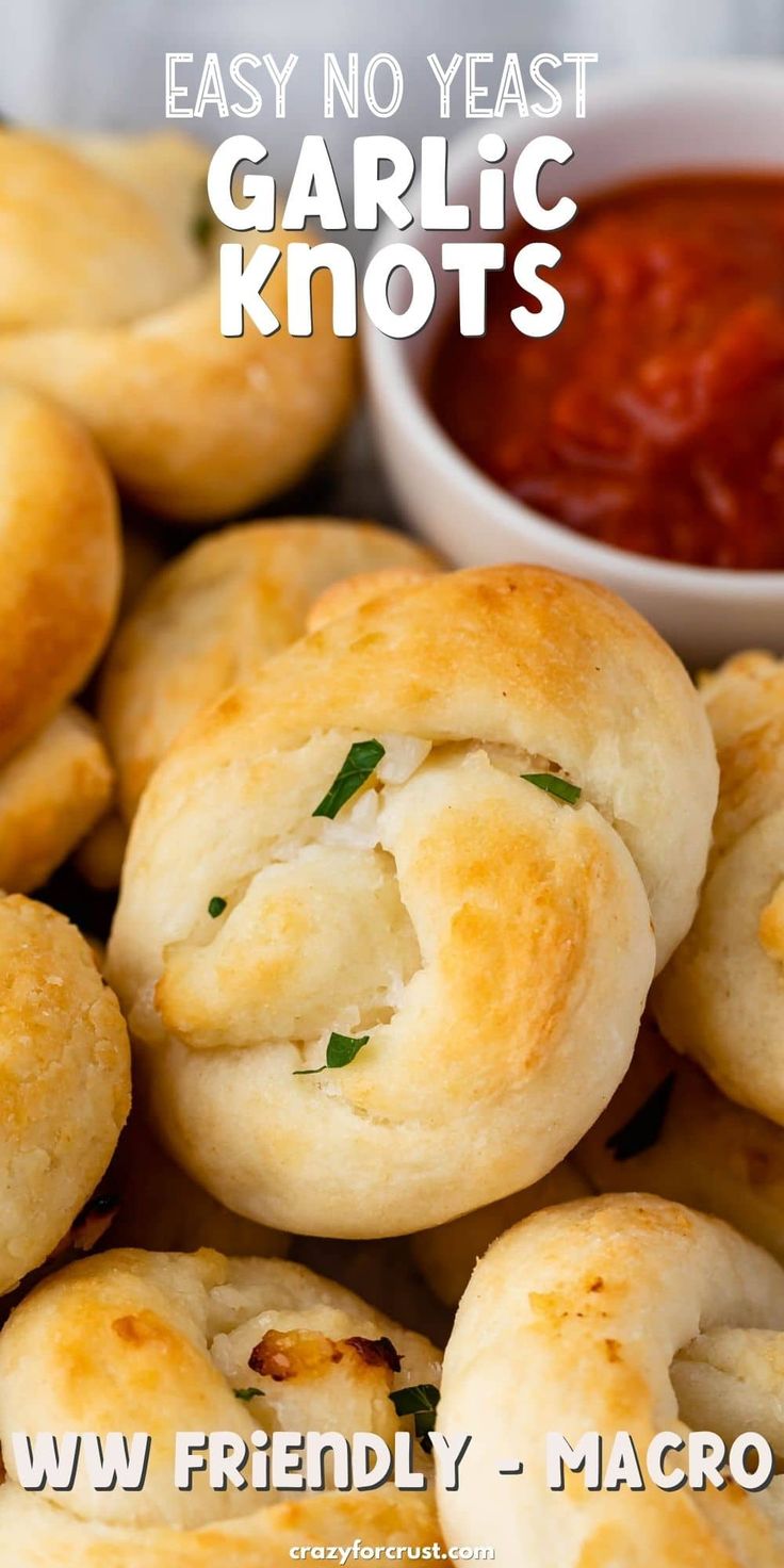 garlic knots with ketchup and dipping sauce on the side, ready to be eaten