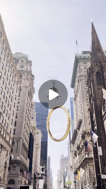 a city street filled with lots of tall buildings and people walking on the sidewalk in front of them