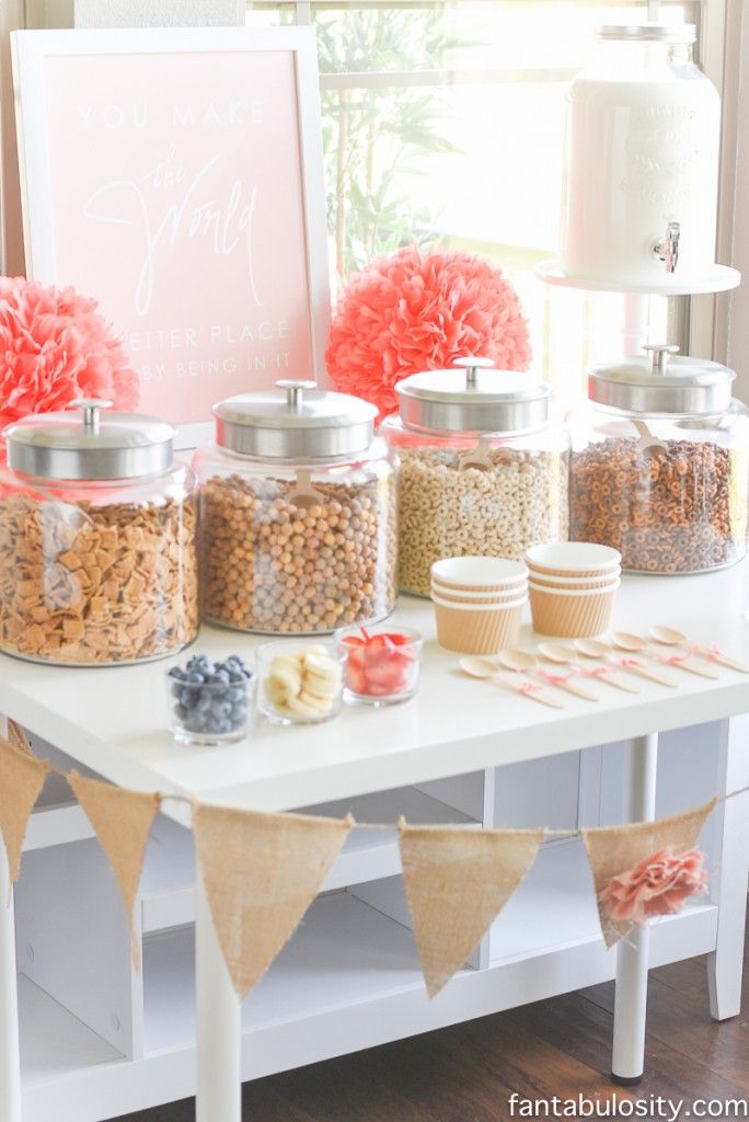 a table topped with lots of food next to a window