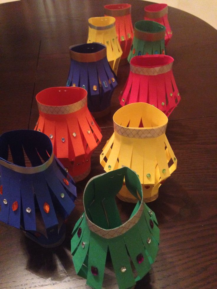 several different colored paper lanterns on a table with text overlay that reads seven of the fastest crafts for children that are also super cute