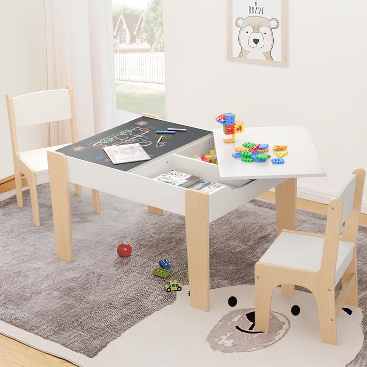 a child's table and chair set in a room with toys on the floor