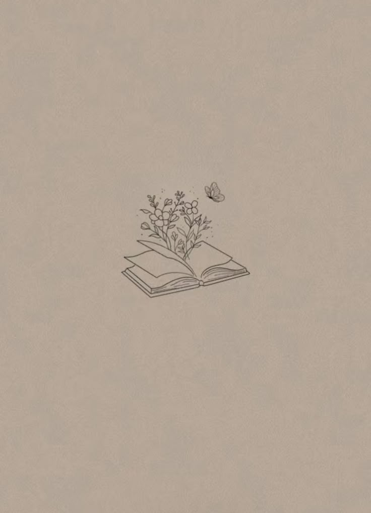 an open book sitting on top of a table next to a butterfly flying over it