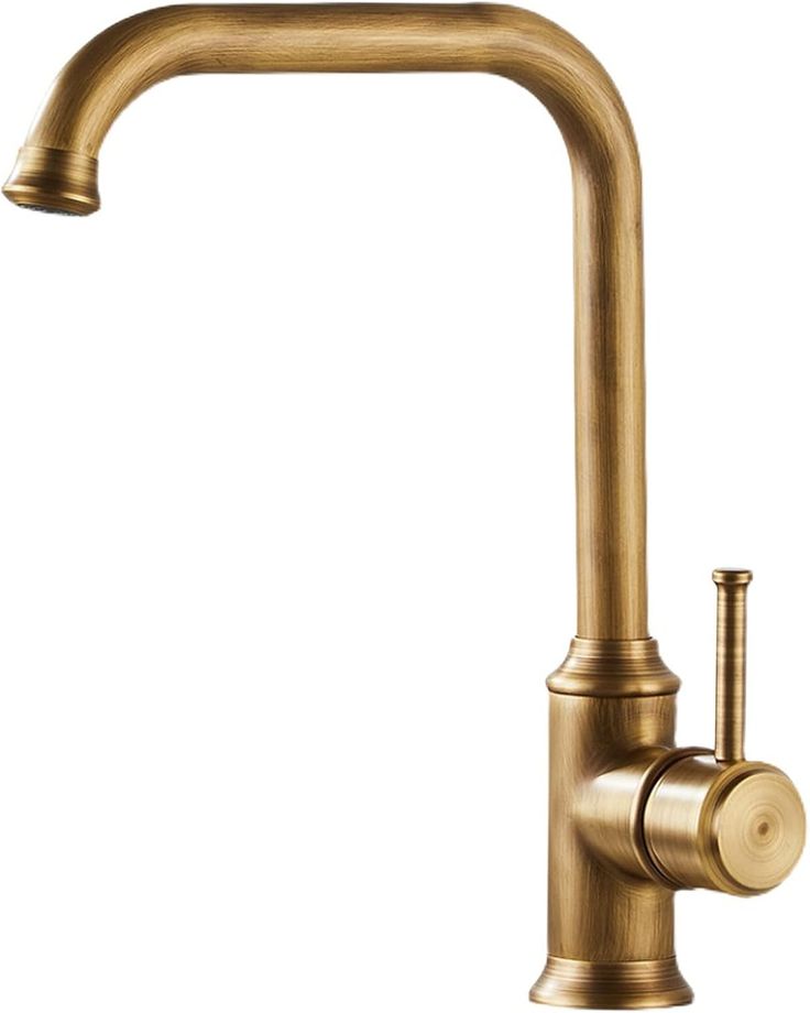 an antique brass faucet on a white background