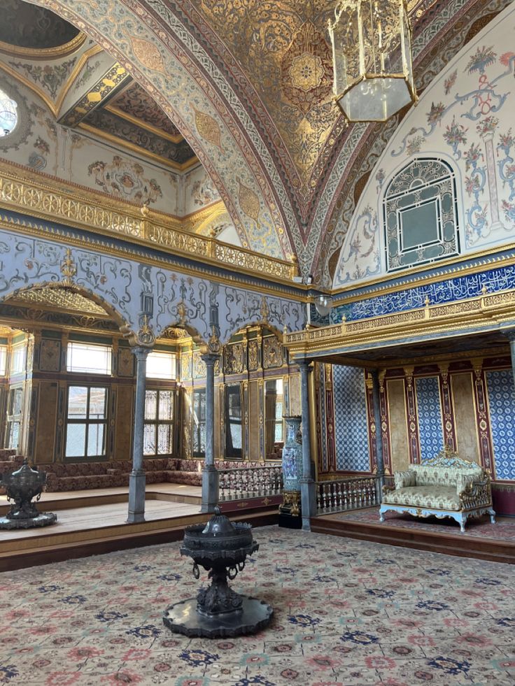 an ornately decorated room with blue and gold walls