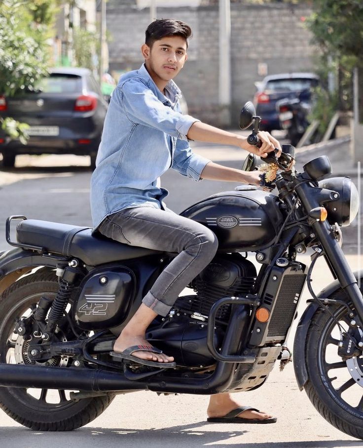 a man riding on the back of a motorcycle