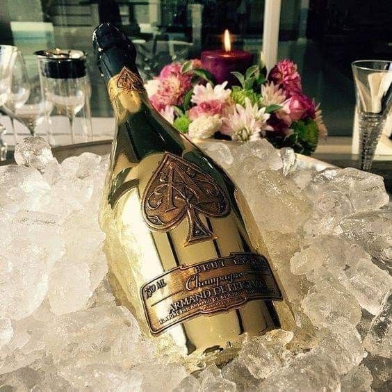 a bottle of champagne sitting on top of ice