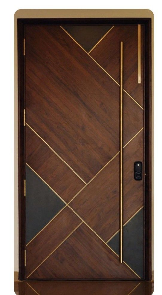 a wooden door with gold accents and a black frame on the wall above it is an abstract