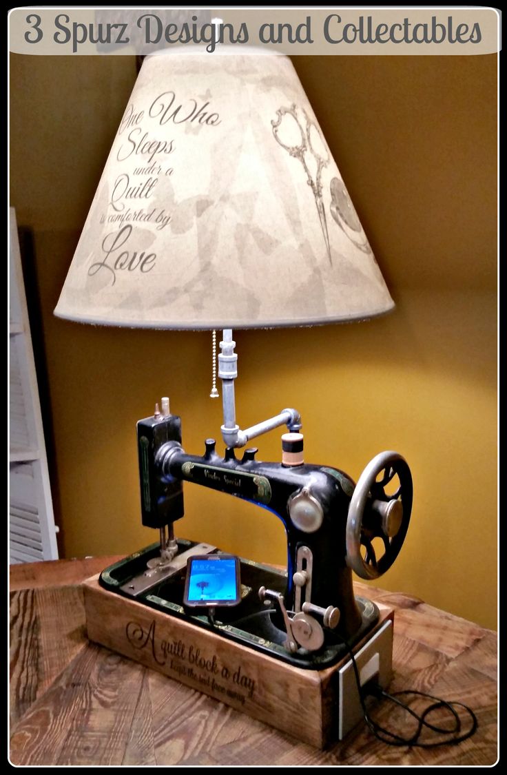 an old sewing machine is turned into a lamp with the words, 3 spritz designs and collectables on it