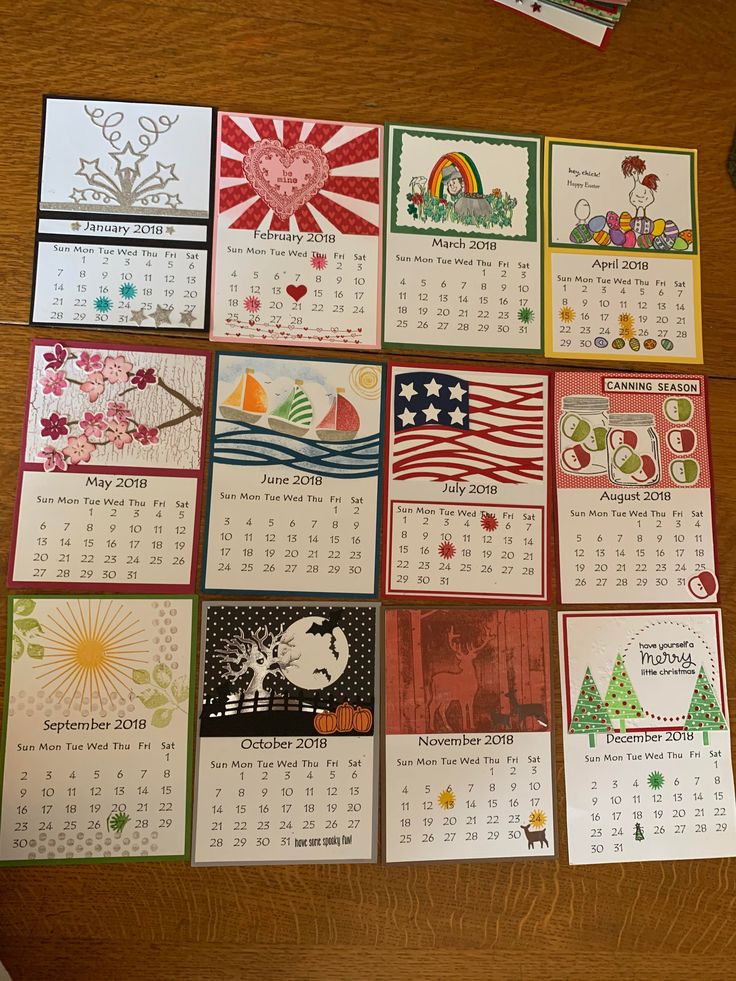 several calendars are arranged on a table