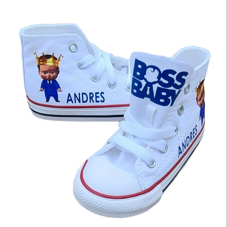 a pair of white high top shoes with an image of a baby boy