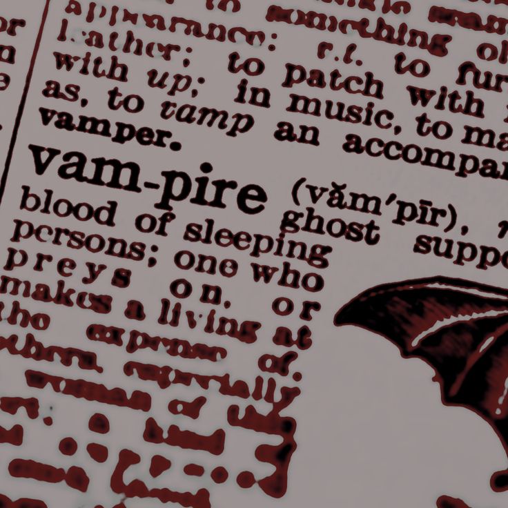 an open book with some type of writing on it's pages and the words vampire written in red ink