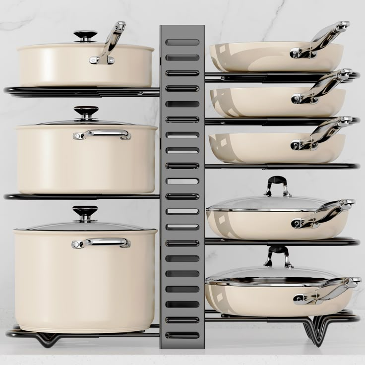 pots and pans are stacked on the rack