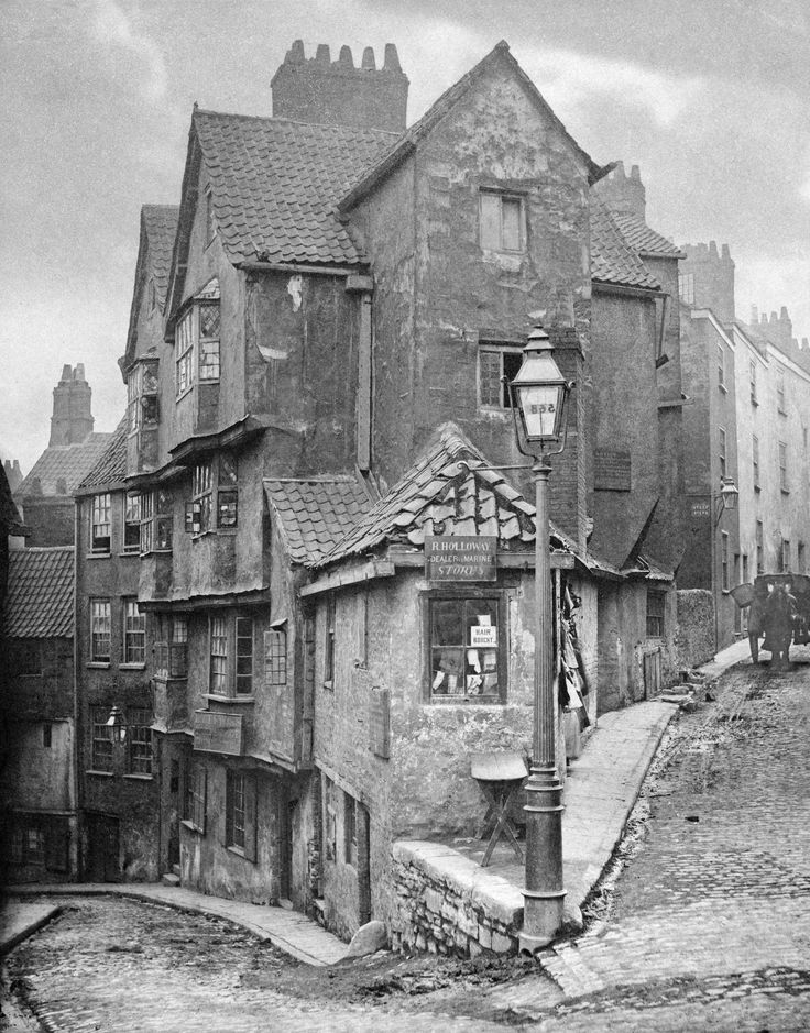 an old black and white photo of some buildings