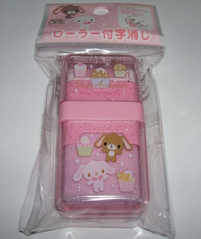 two pink boxes with animals on them sitting in a plastic packaging bag, one is open and the other is closed