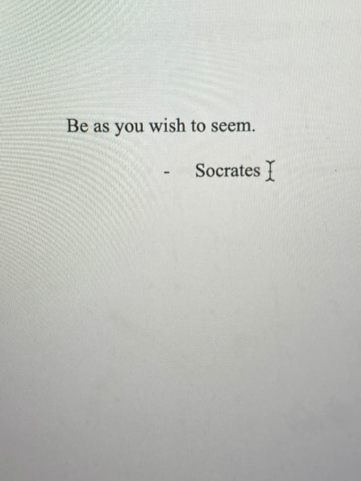 the words be as you wish to seem soccrats i are written in black ink