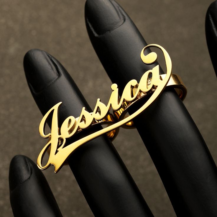 Product Description: Introducing our stunning Gold Two Finger Name Ring, the perfect personalized accessory to showcase your unique style. This custom nameplate ring is beautifully crafted from stainless steel and features a gorgeous 3D name design. With its real gold plating, this ring is not only fashionable but also durable, ensuring it won't easily fade or be damaged. The Gold Two Finger Name Ring allows you to customize the name engraved on the ring, making it a truly special and meaningful Customized Nameplate Rings For Anniversary, Custom Gold Engraved Personalized Ring, Fingers Name, Custom Text Gold Rings For Anniversary, Gold Rings With Custom Text For Anniversary, Elegant Nameplate Rings, Customizable Gold Engraved Ring For Personalized Gift, Gold Ring With Custom Text, Customizable Nameplate Rings For Gifts