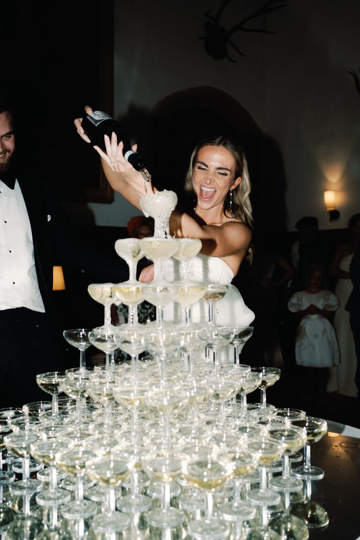 Bride is stood over a tower of champagne glasses and pouring champagne into the glasses: whilst smiling and enjoying her wedding day. Dream Wedding Decorations, Champagne Tower, Wedding Money, Future Wedding Plans, Dream Wedding Ideas Dresses, Champagne Wedding, Wedding Goals, Nyc Wedding, London Wedding