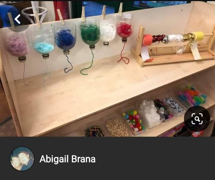 there are many different items on the counter in this shop, including yarns and beads