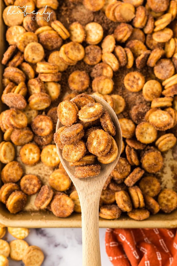 a wooden spoon filled with cinnamon sugar nuts