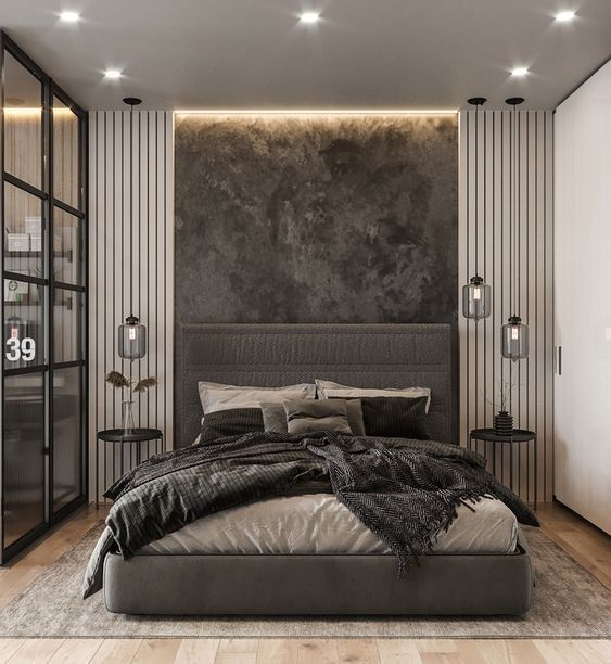 a large bed sitting in the middle of a bedroom next to a tall glass door