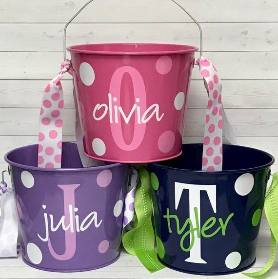 three personalized buckets with polka dots on them, one is pink and the other is blue