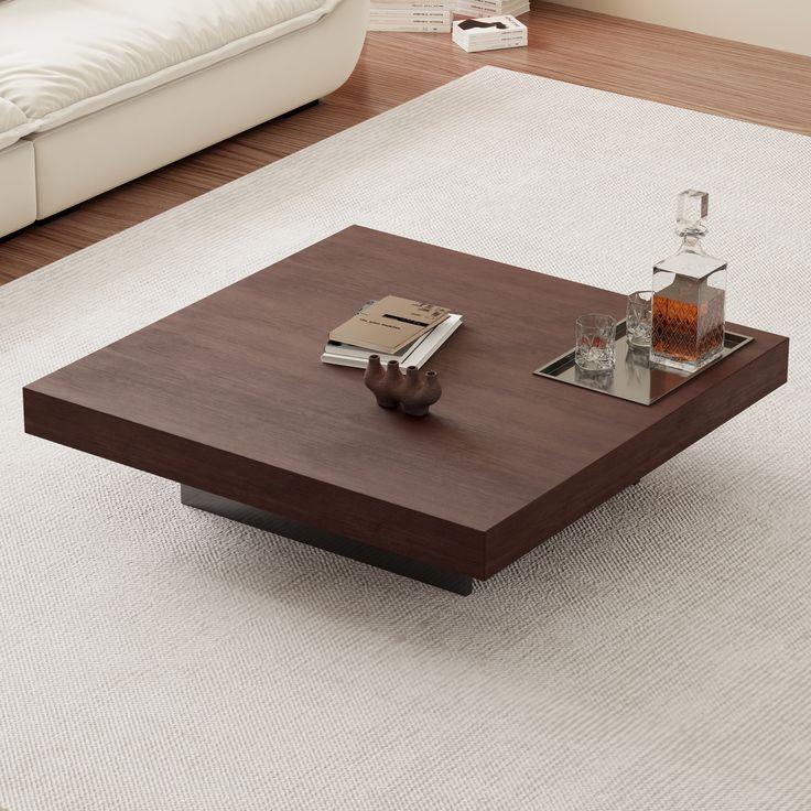 a coffee table sitting on top of a white rug