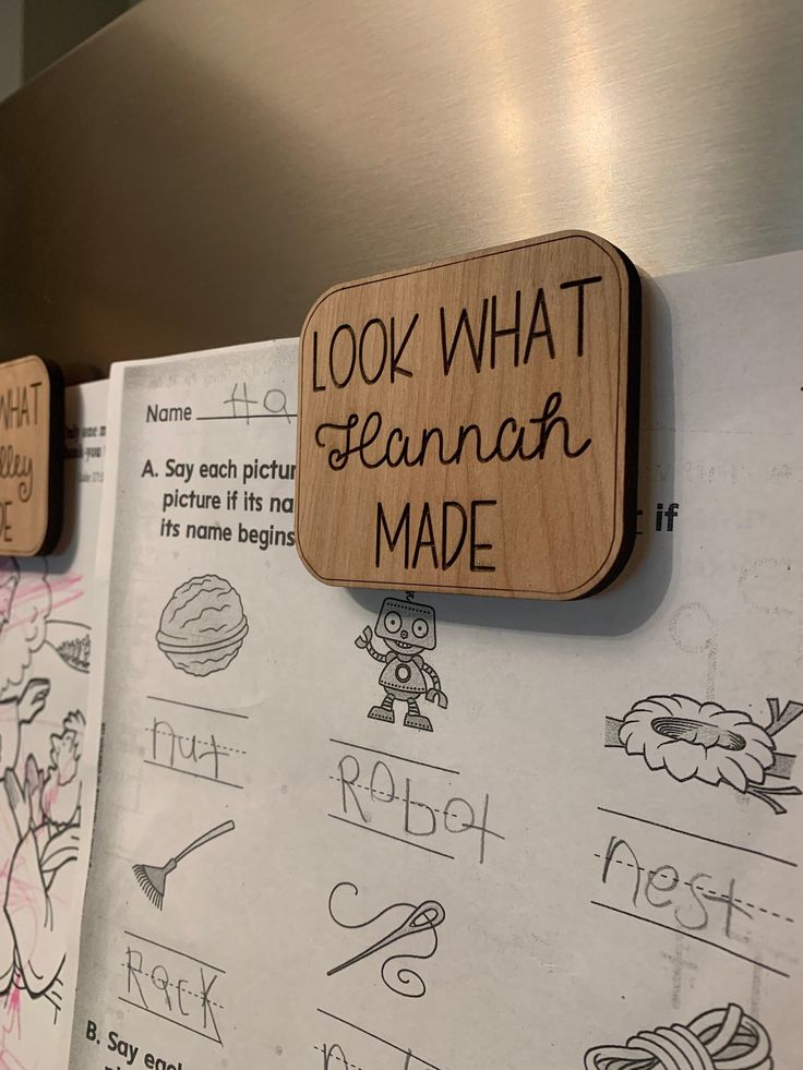 wooden magnets with writing and pictures on them