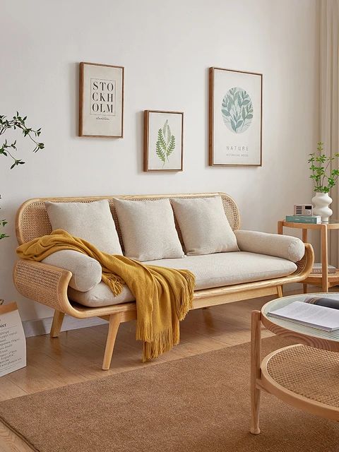 a living room scene with focus on the couch and coffee table in the foreground