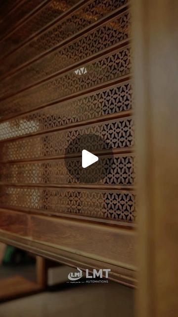 an image of the inside of a room with wooden walls and decorative screens on it