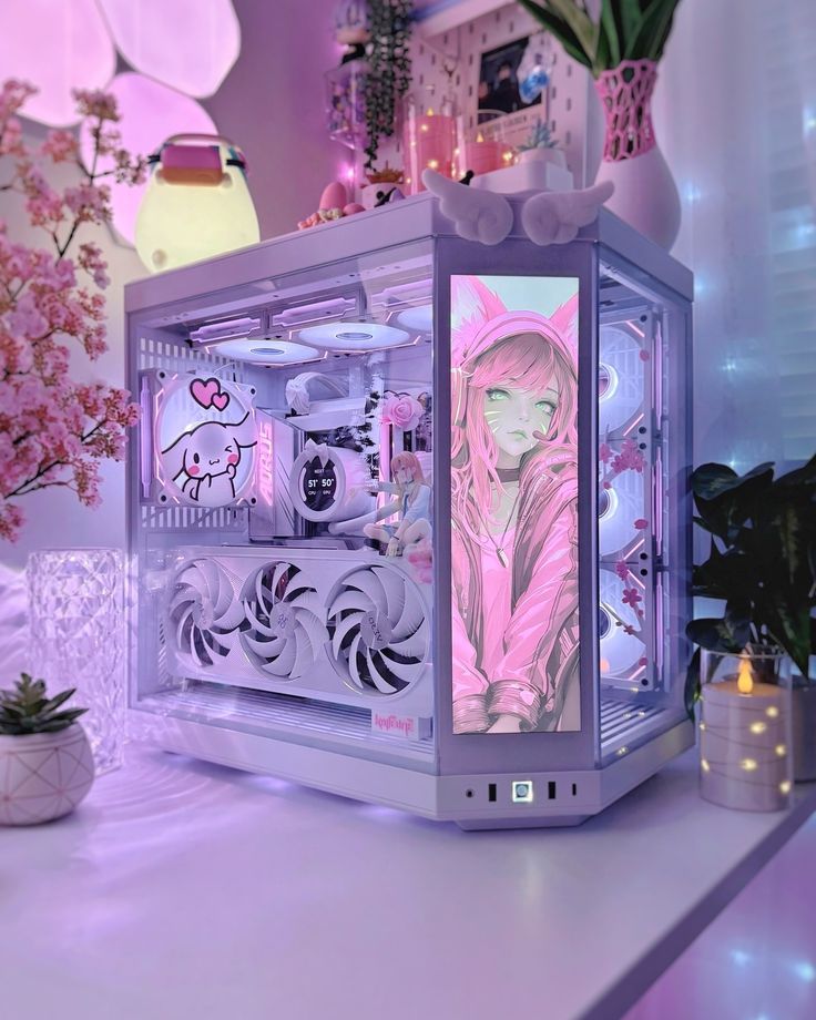 a pink and white display case sitting on top of a table next to a potted plant