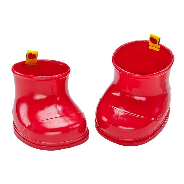 pair of red rain boots with yellow tags on them