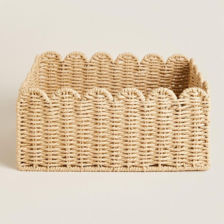 an empty wicker basket on a white background