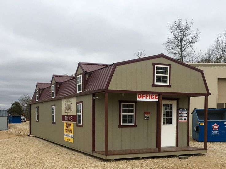 a small building with a sign for coffee on it