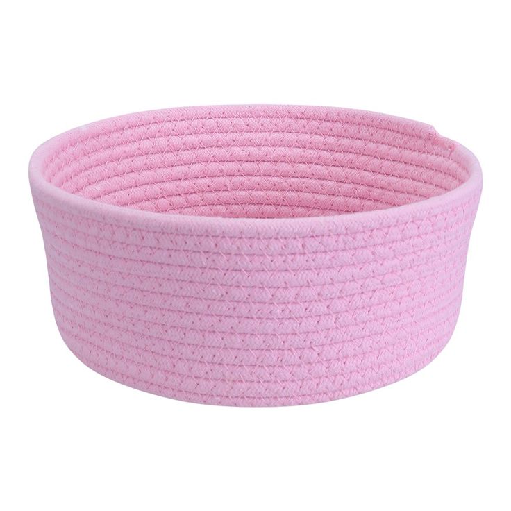 a pink round basket with braiding on the sides and bottom, sitting in front of a white background