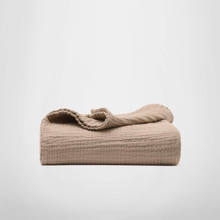 an image of a folded towel on a white background with room for text or images