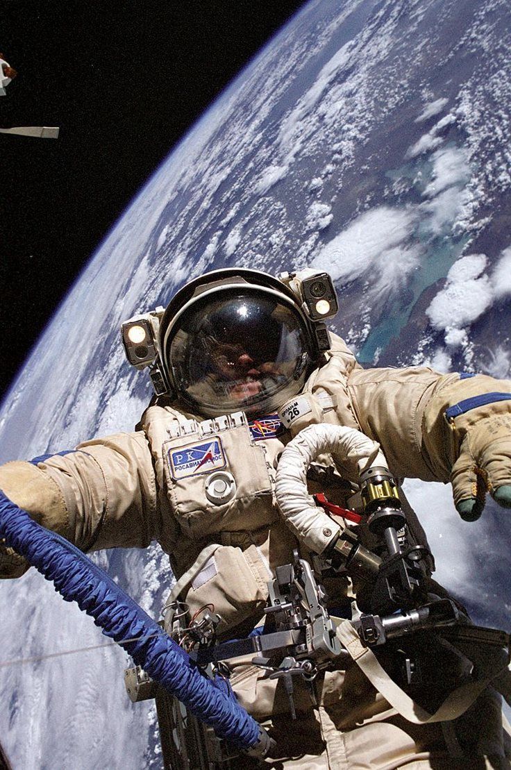 an astronaut in outer space with earth in the background