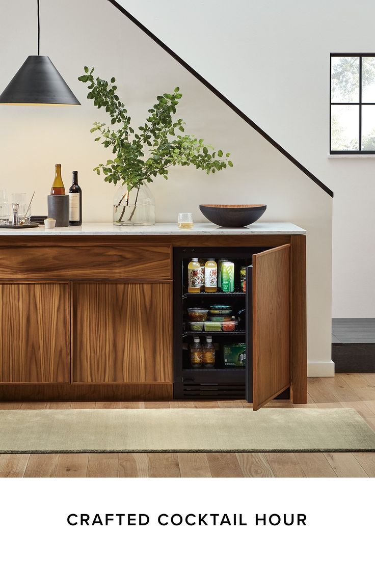 a wooden cabinet with an open door and shelves