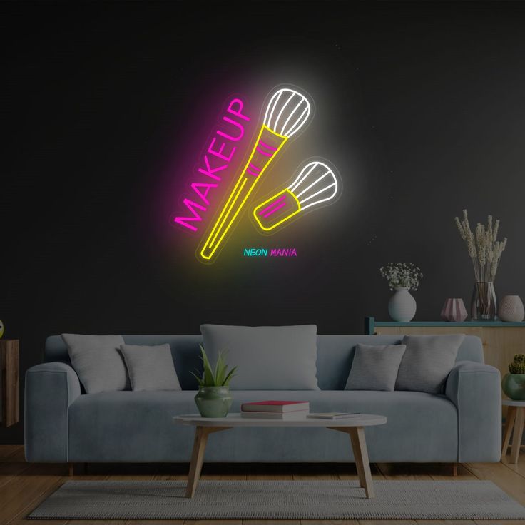 a living room filled with furniture and a neon sign that says makeup on the wall