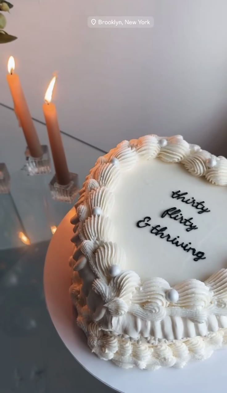 a birthday cake with candles in the background