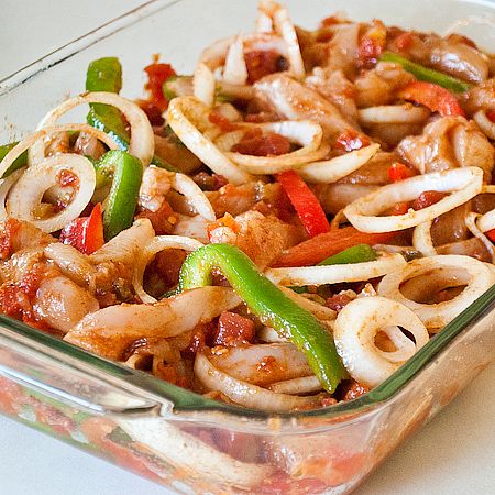 a glass casserole dish filled with pasta and vegetables