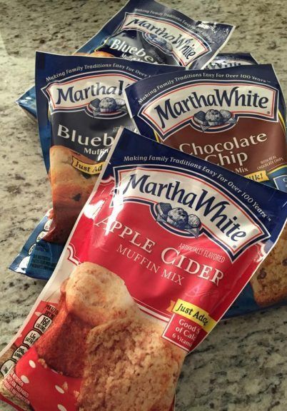 three bags of martha white apple cider muffin mix sitting on a counter top