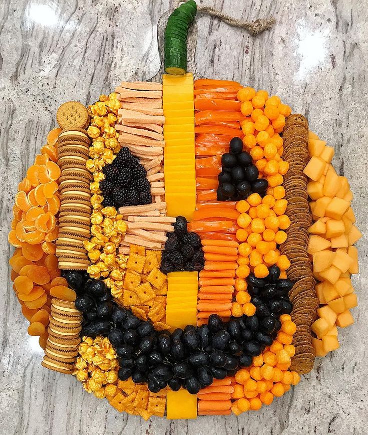 a pumpkin made out of fruits and vegetables