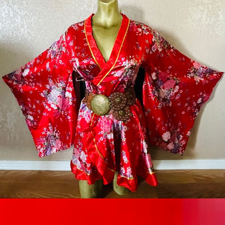 "This is a beautiful vintage 90's satin kimono.  No tags, medium-weight satin in red with floral print and gold trim.  Beautiful huge kimono sleeves (not vented).  Item has one inner tie and one outer tie at waist (belt not included).  Approximate uncinched measurements are 34\" at bust, 33\" at waist, 50\" at hips, 32\" in length, 28\" in sleeve length, 40\" around cuffs, 17\" shoulder-to-shoulder.  Mannequin measures 34C at bust, 26\" at waist, 34\" at hips.  Item sold in gently-used condition." Spring Party Satin Kimono, Fitted Satin Kimono, Fitted Red Kimono For Spring, Red Kimono With Kimono Sleeves For Festival, Fitted Red Long Sleeve Kimono, Red Robe With Kimono Sleeves For Spring, Spring Satin Kimono With Kimono Sleeves, Floral Print Kimono, Kimono Vintage