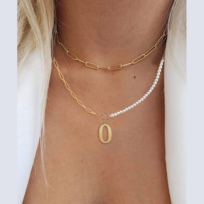 This modern necklace features the timeless elegance of shimmering pearl simulants on one side and shimmering gold over brass links on the other side, giving it a half-and-half style, perfect for mixing and matching. A shiny initial of your choice hangs in the center, hanging from a toggle clasp. Necklace measures approximately 14"L and includes a 2" extender. O Necklace Letter, Toggle Necklace, Modern Necklaces, Diy Crafts Jewelry, Letter Necklace, Chain Link Necklace, Timeless Elegance, Jewelry Crafts, Pearl Necklace